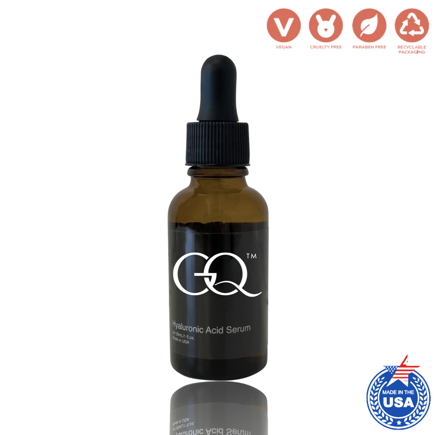 GQ Hyaluronic Acid Serum in an amber glass dropper bottle with a black label and black dropper cap, shown on a white background with vegan, cruelty-free, and parabens-free icons at the top, and a made in the USA badge at the bottom right.